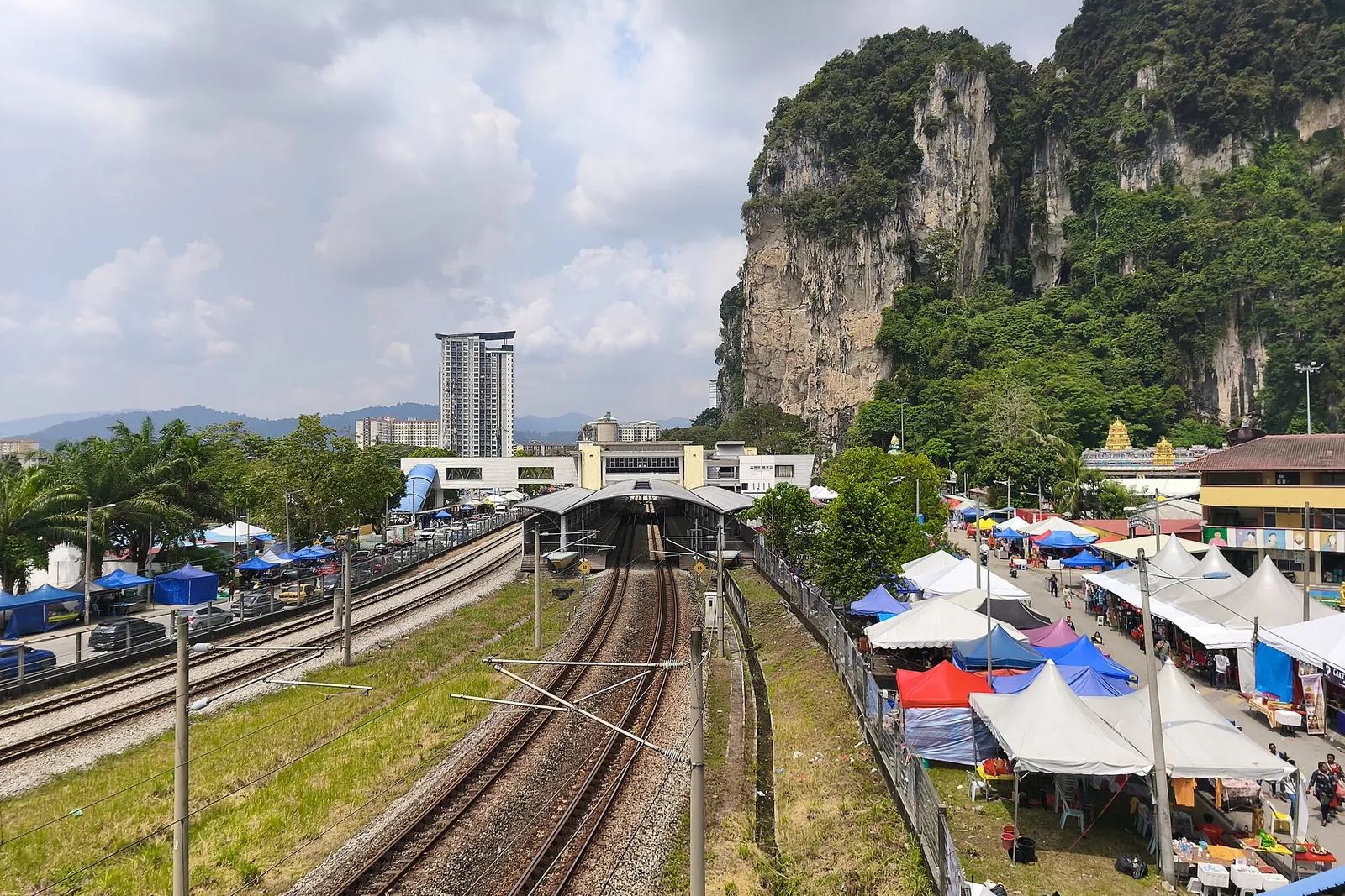 KTM Komuter tracks at Batu Caves station below the limestone cliffs