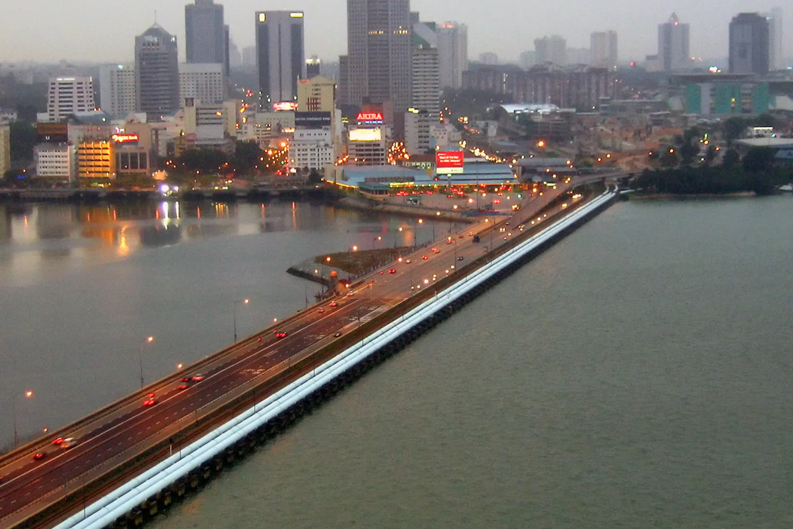 The Johor–Singapore Causeway with the Johor Bahru skyline at dusk